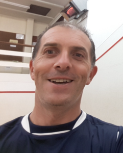 Paul Macari on a squash court.